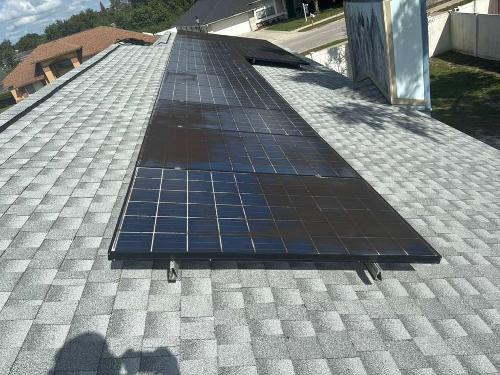 Solar panels with visible dust and residue before cleaning